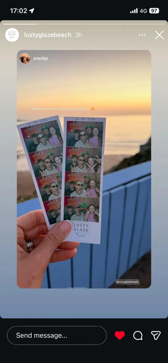 Printed photo strips held at sunset